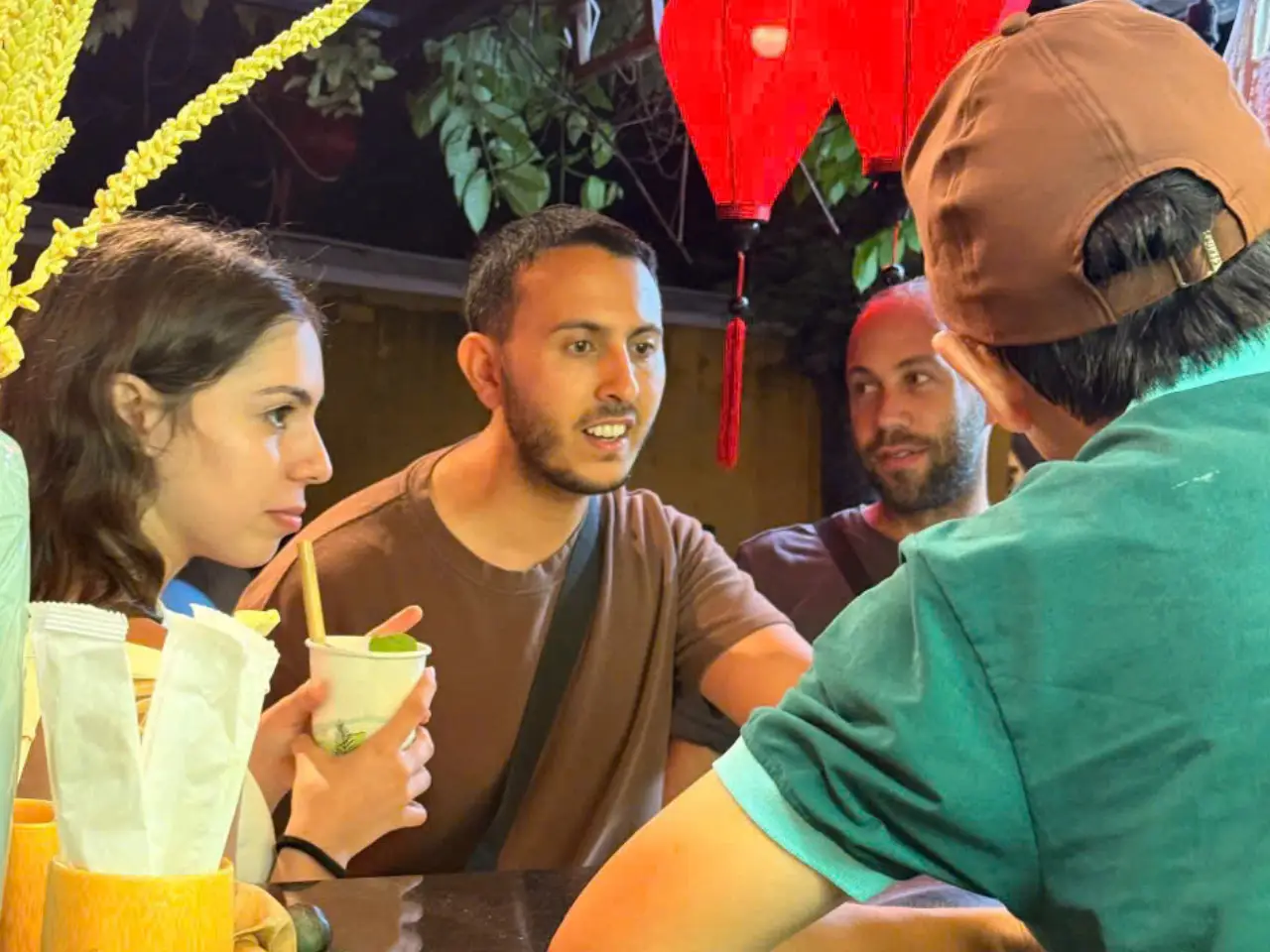Travelers enjoying palm nectar drinks at Hoa Arika Hoi An.